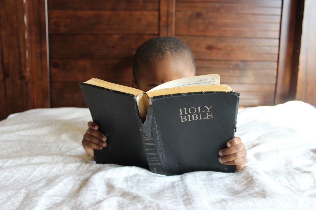 scriptures about courage - Child Reading The Bible