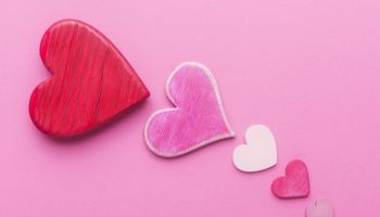 Decorative Valentines hearts over pink background with copy space. Valentineâs day conceptual greeting