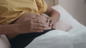 A Mother's Touch, A Close up of a Pregnant Woman's Hands on Her Belly
