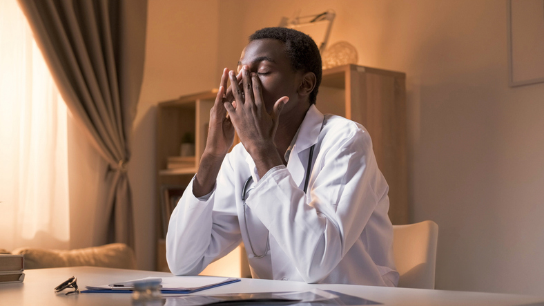 how to recover from burnout - Tired doctor professional fatigue working late