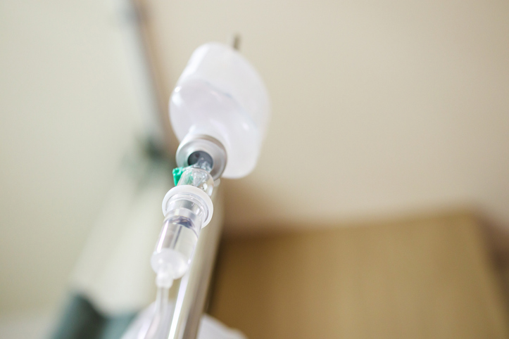 pig kidney transplant - Close up medical intravenous IV drip in hospital background