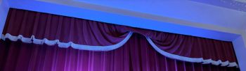 Velvet stage curtain in an auditorium