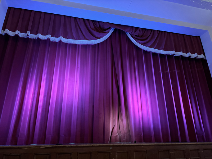 the preacher's wife musical - Velvet stage curtain in an auditorium