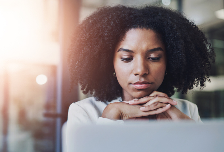 Business, thinking and black woman with laptop, decision and online reading for spell check, editing and lens flare. African person, startup and copywriting consultant with pc or research for article